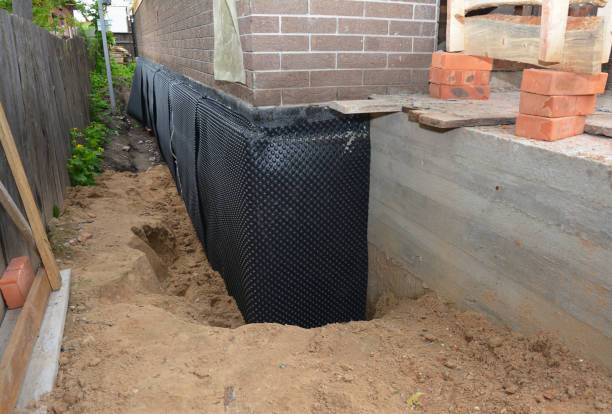 SJ Waterproofing Pros technician performing targeted Foundation Crack Repair assessment in Montgomery, IL